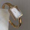 Elegant Gold-Tone Bangle Watch – Minimalist Dial, Adjustable Bracelet, Stainless Steel & Crystal Accents