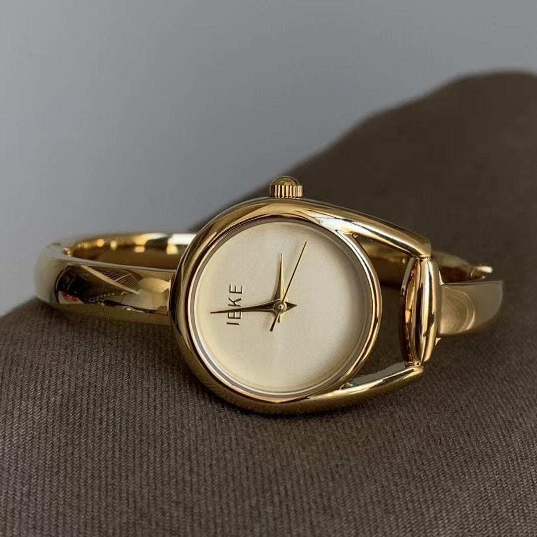 Elegant Gold-Tone Bangle Watch – Minimalist Dial, Adjustable Bracelet, Stainless Steel & Crystal Accents