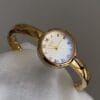 Elegant Gold-Tone Bangle Watch – Minimalist Dial, Adjustable Bracelet, Stainless Steel & Crystal Accents