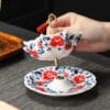 Blue and White Rotating Tea Strainer: Your Free Elegant Ceramic Infuser with Any Tea Order!